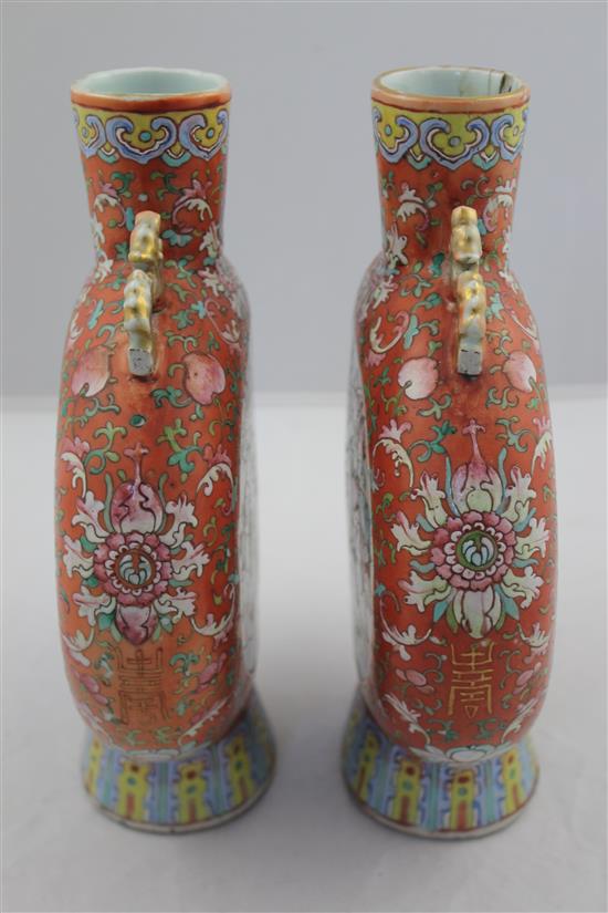 A pair of Chinese famille rose moon flasks, 19th century, 24.2cm, one neck repaired, slight losses to handles
